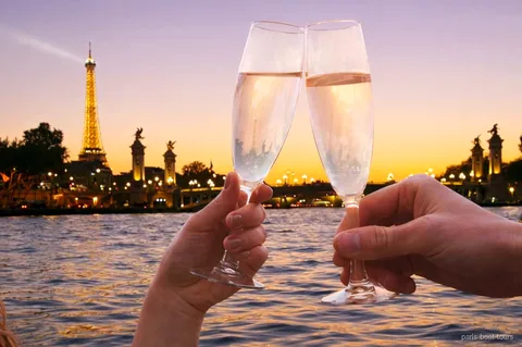 Seine River evening cruise with champagne passing the illuminated Eiffel Tower